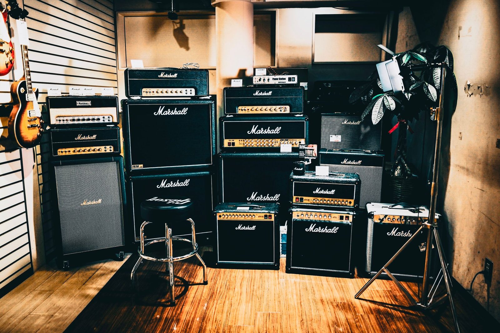 Neatly stacked Marshall amplifiers in a music studio, perfect for rock band sessions.